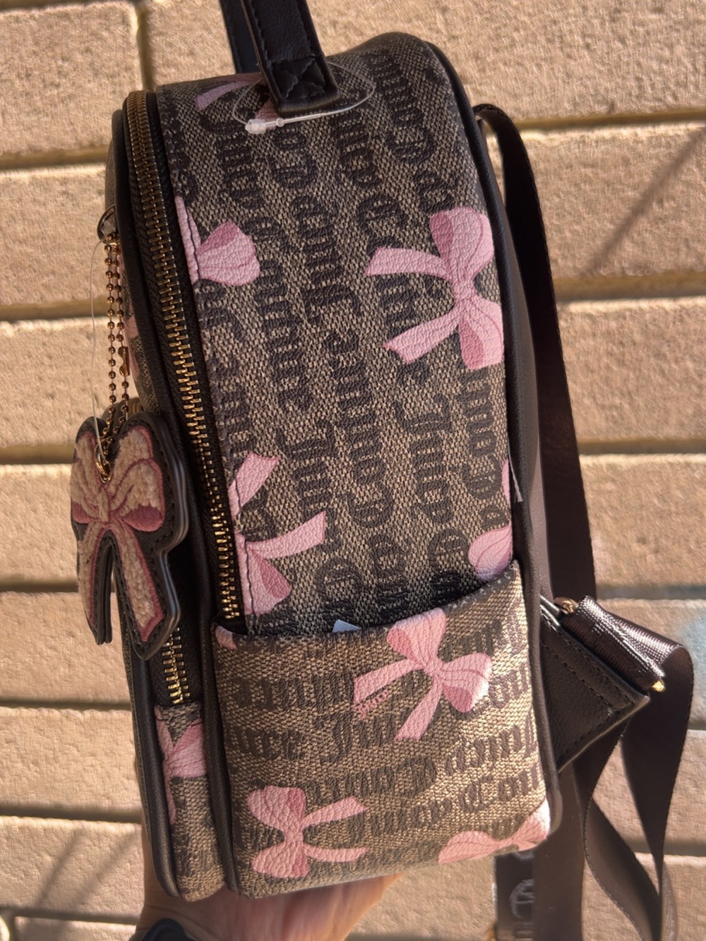 Juicy Couture Brown Monogram Backpack with Pink Bow Accents - Picture 6 of 7